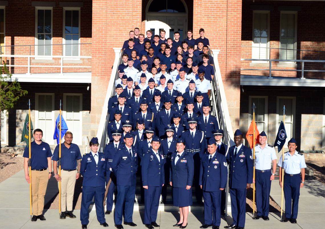 Photo of cadet and staff in front of Old Main. 