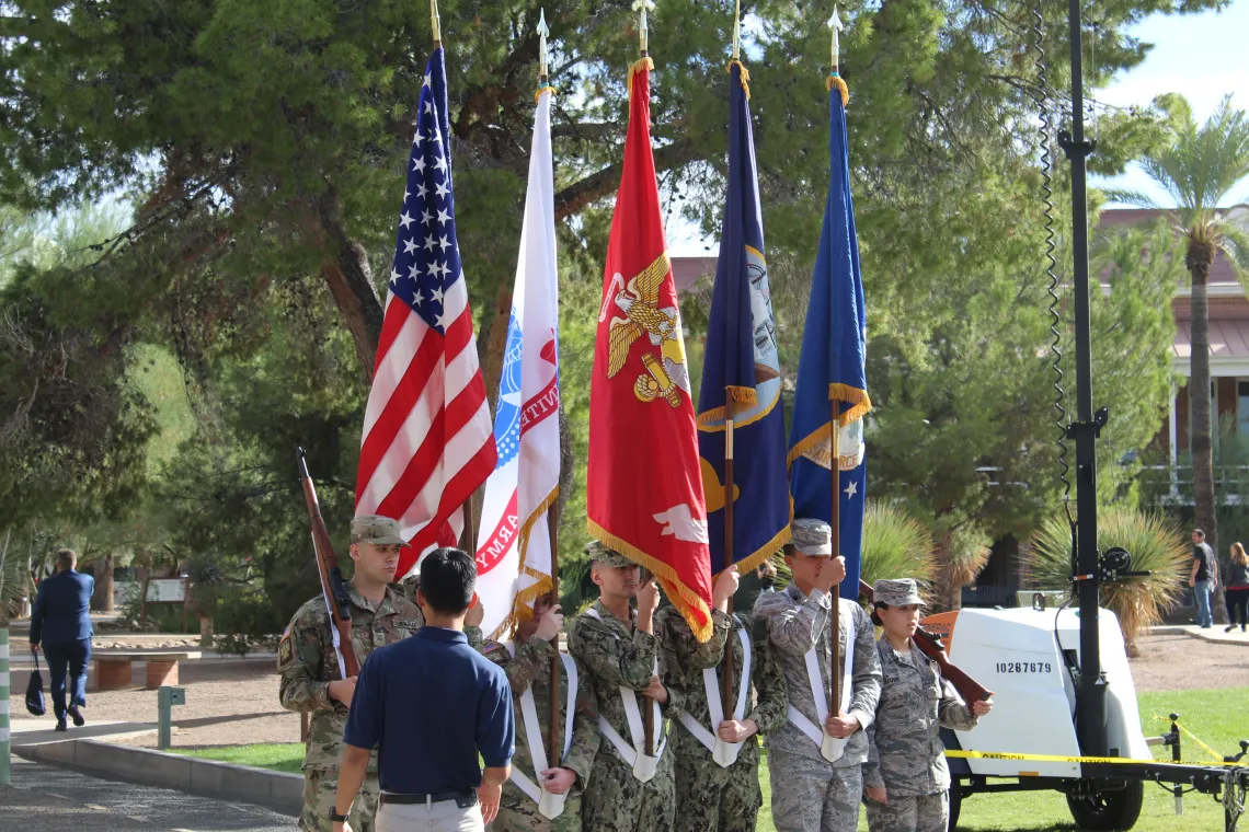 person in uniform presenting info to other people in uniform